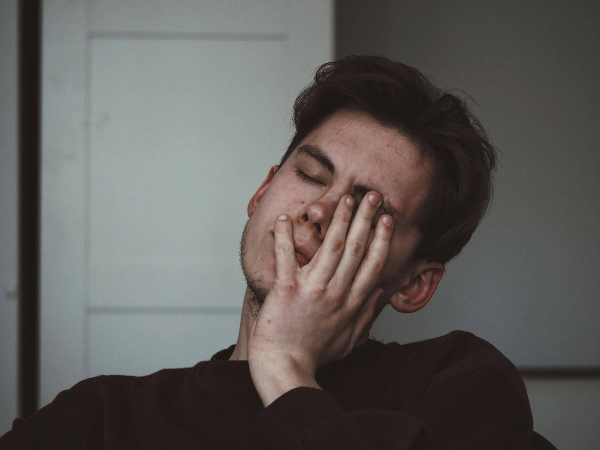 Does HubSpot feel more like a burden than a system? A picture of a man feeling the stress of a chaotic HubSpot CRM