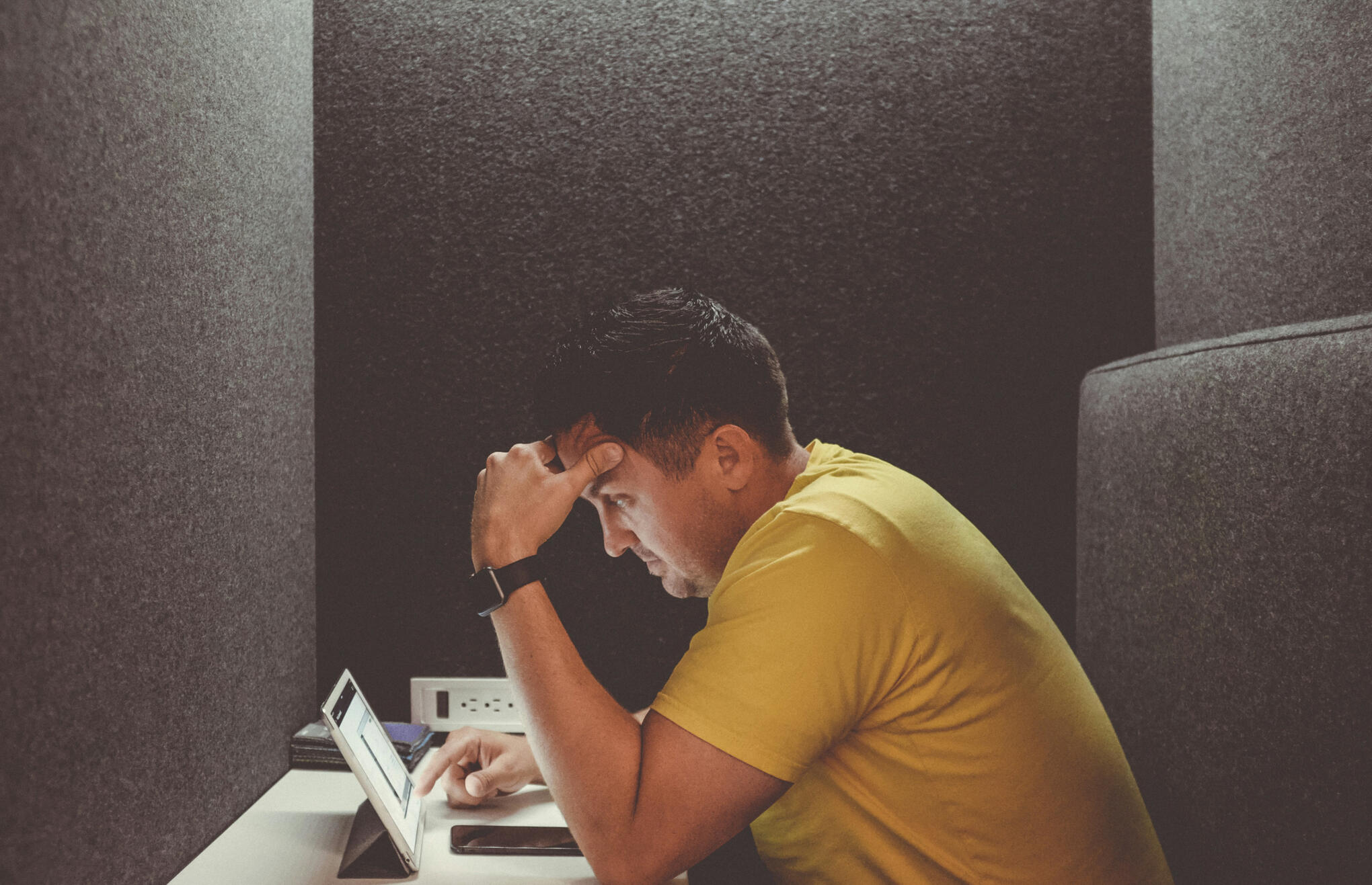 What would actually happen if you doubled your clients overnight? A picture of a man stressed with too much client work
